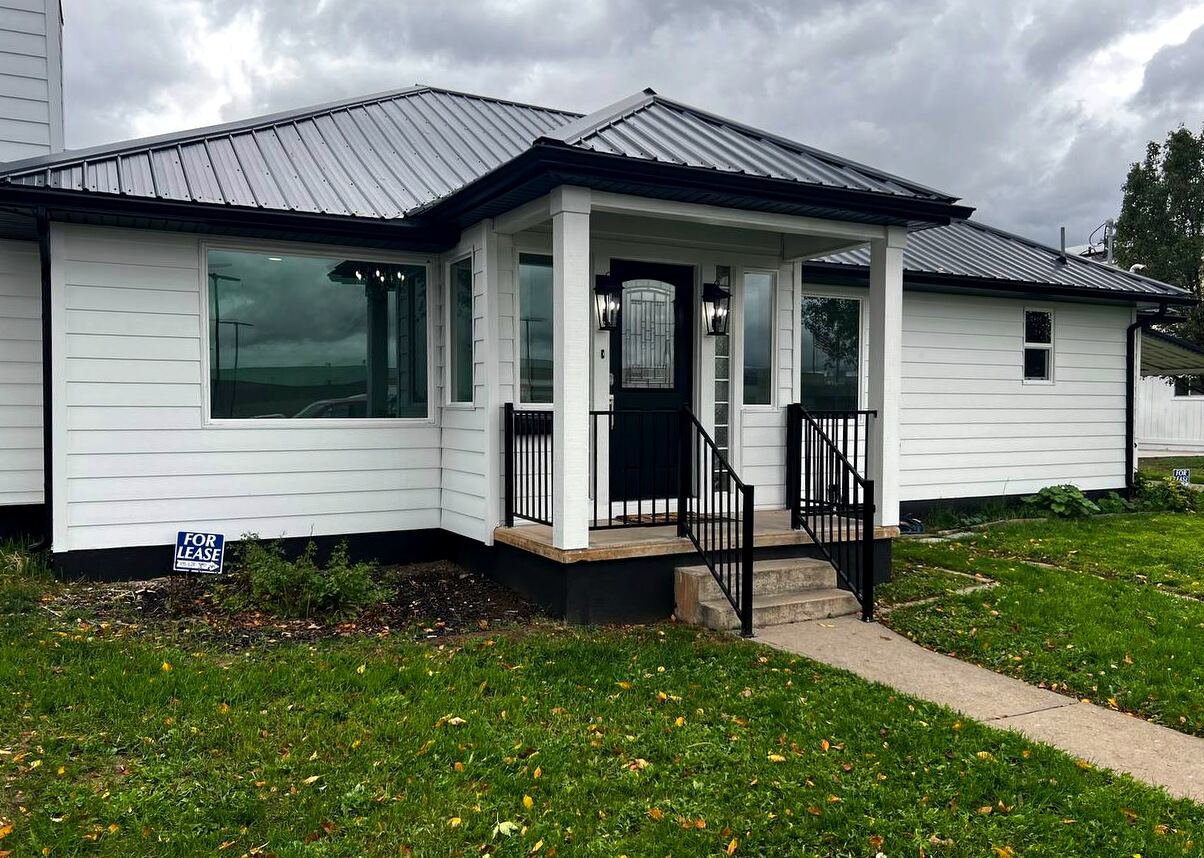 Angled view of the front elevation and corner lot